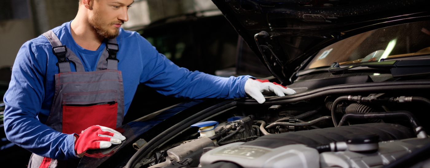 Mechanic doing an MOT test on a vehicle - MOT Widnes