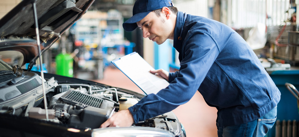 Mechanic going over a full service - Car Servicing Widnes